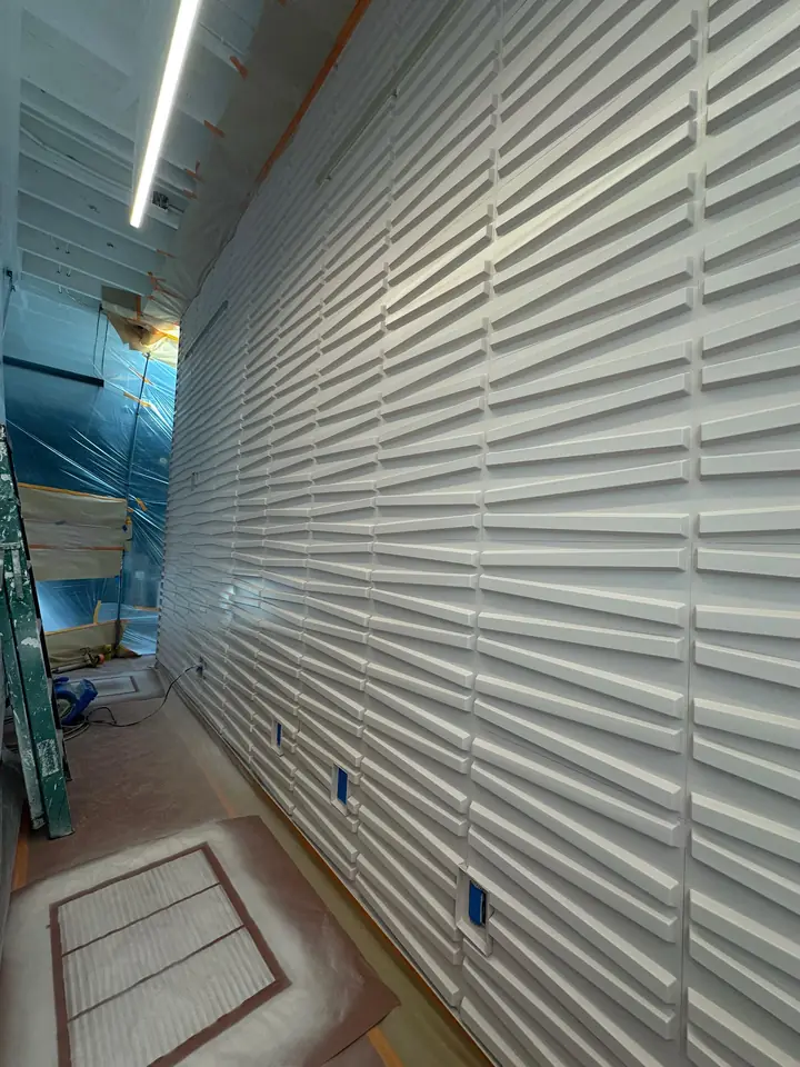 Commercial interior finished in teal with white louvered ceiling