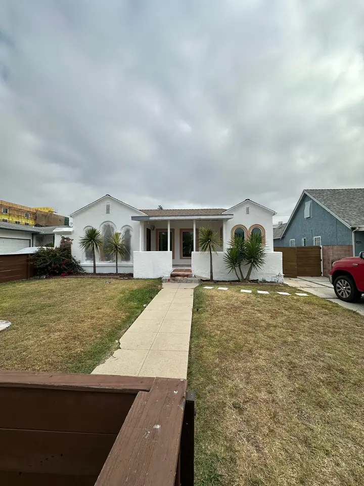 Single story home with freshly painted white exterior and trim